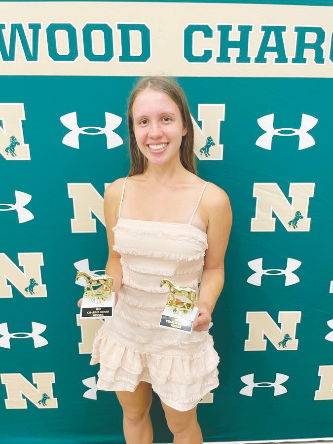 Northwood senior Emma Serrano poses with both of her Charlie awards, including one for indoor track and another for Female Breakthrough Athlete of the Year, during the Charlie Awards banquet on May 18.