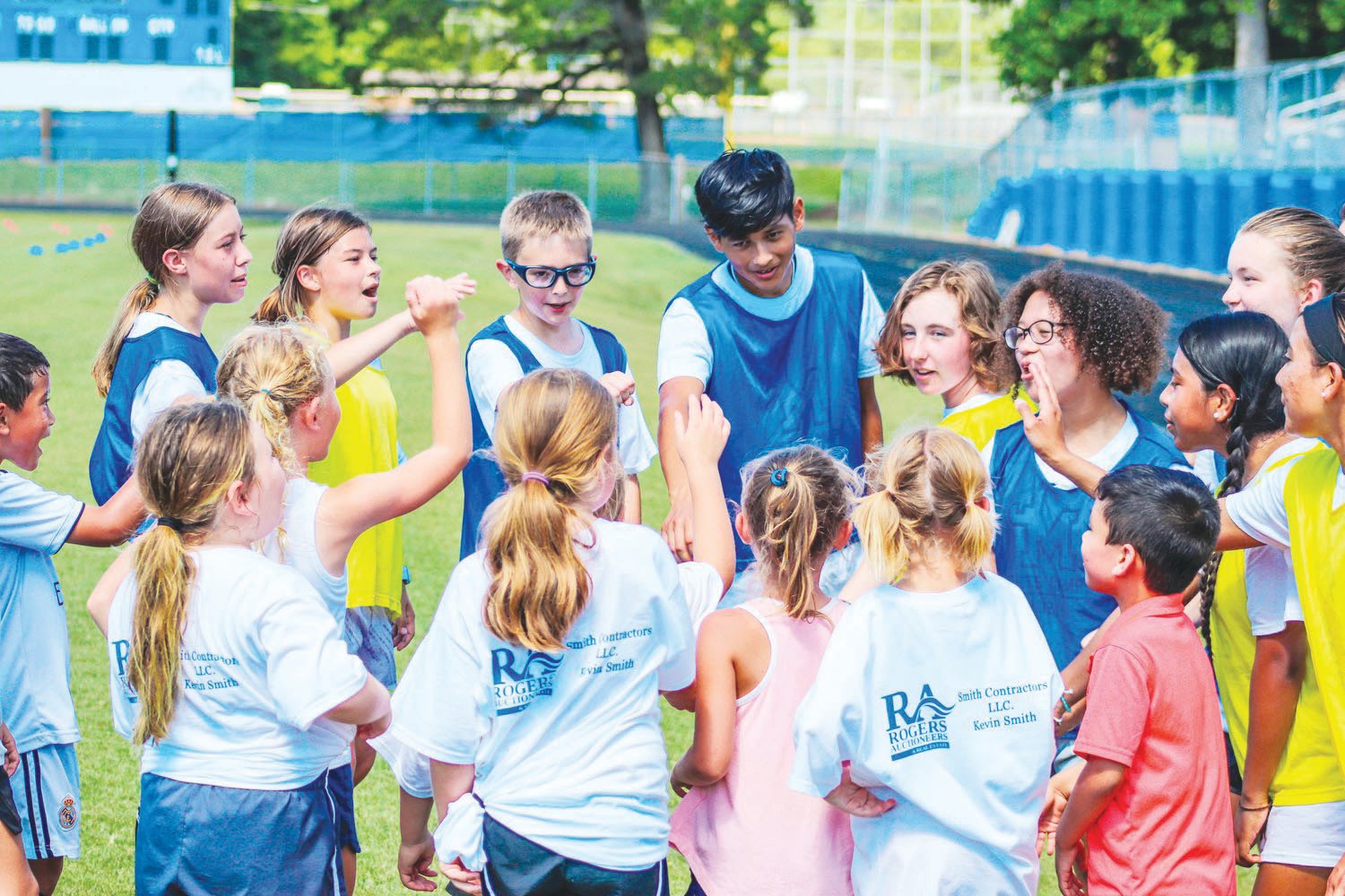 A group of campers at Jordan-Matthews' youth soccer camp – including counselor and J-M soccer player Carlos Rojas (top center, in blue) — recite a chant about popsicles on the final day of camp on July 1, 2021. This was the first-ever youth soccer camp hosted by the Jets.