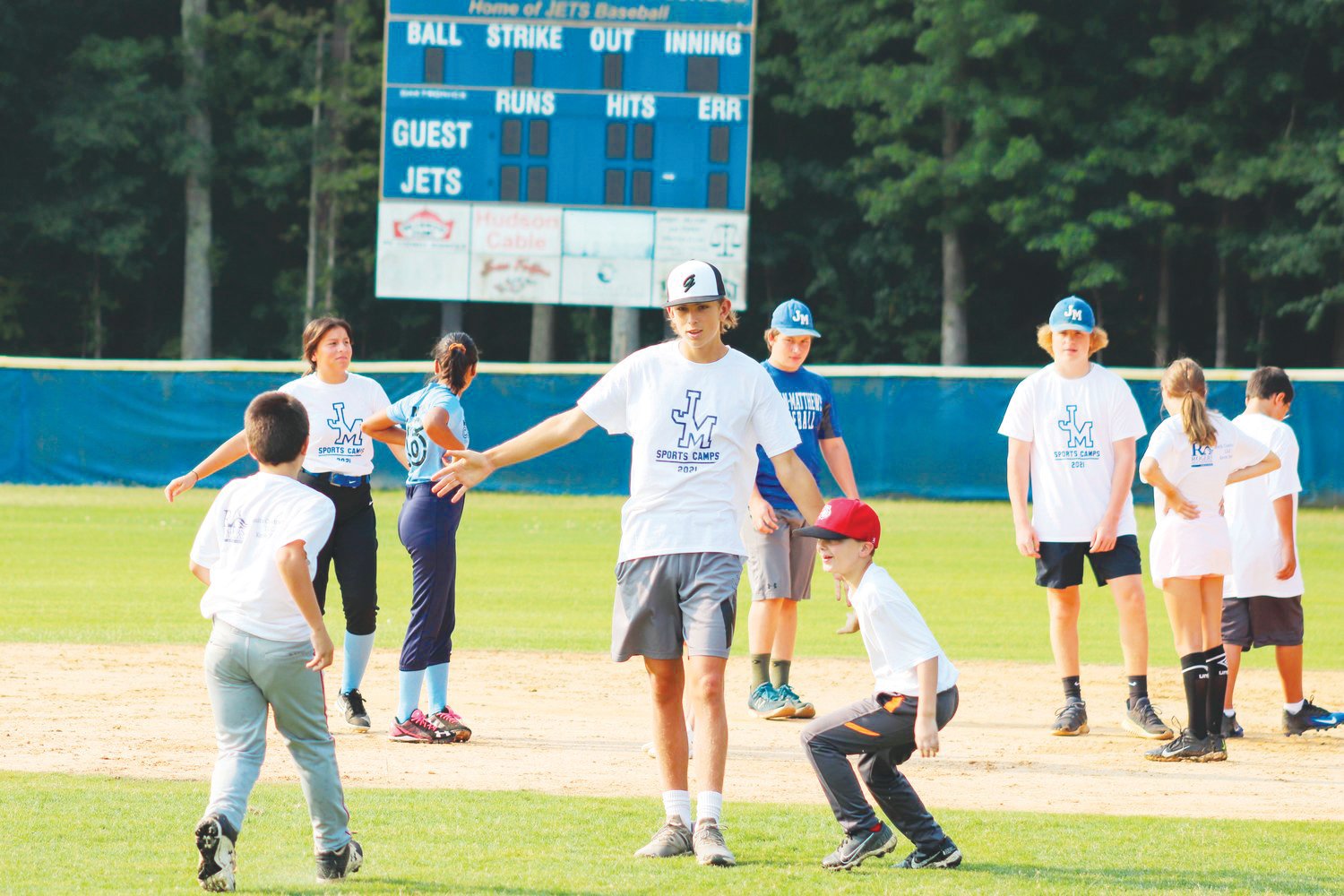 Jordan-Matthews volunteer camp counselor and baseball player Kelton Fuquay keeps spirits high among the campers during the final day of the Jets' youth baseball/softball camp on July 22, 2021. In total, 75 campers attended — the highest number of any J-M camp last year.