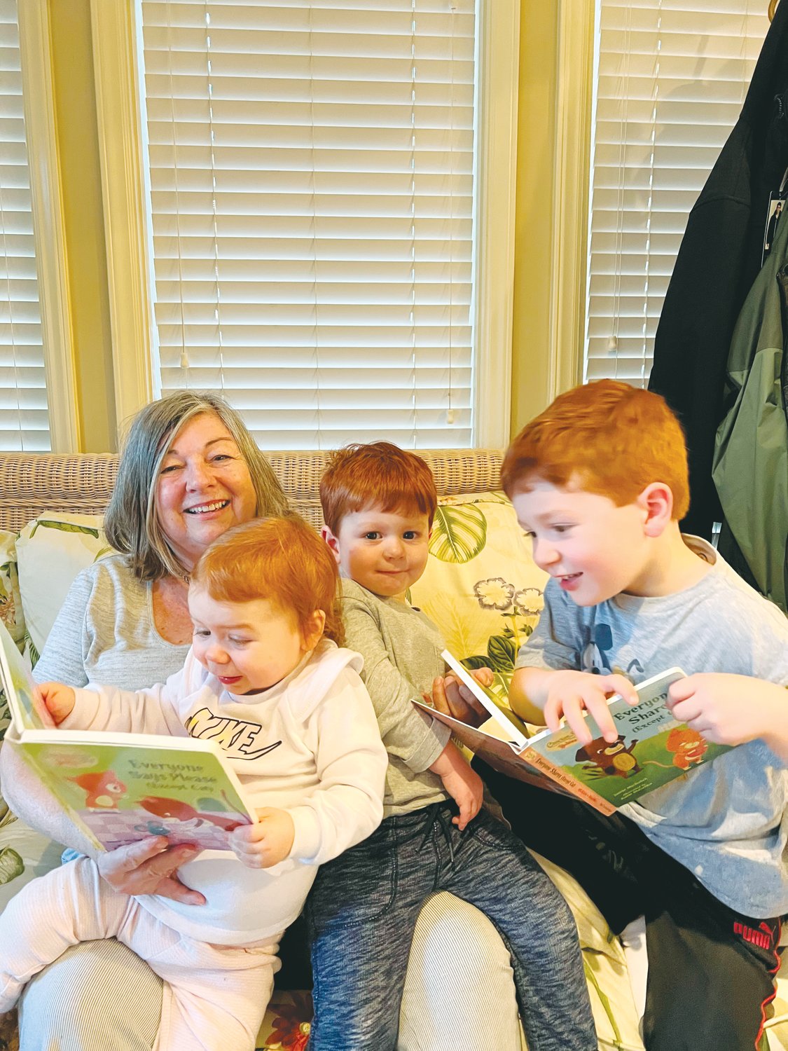 Chatham author Erika Hoffman reads one of her stories to three of her eight grandchildren. Hoffman, a retired educator, has contributed 17 stories to the 'Chicken Soup for the Soul' book series.