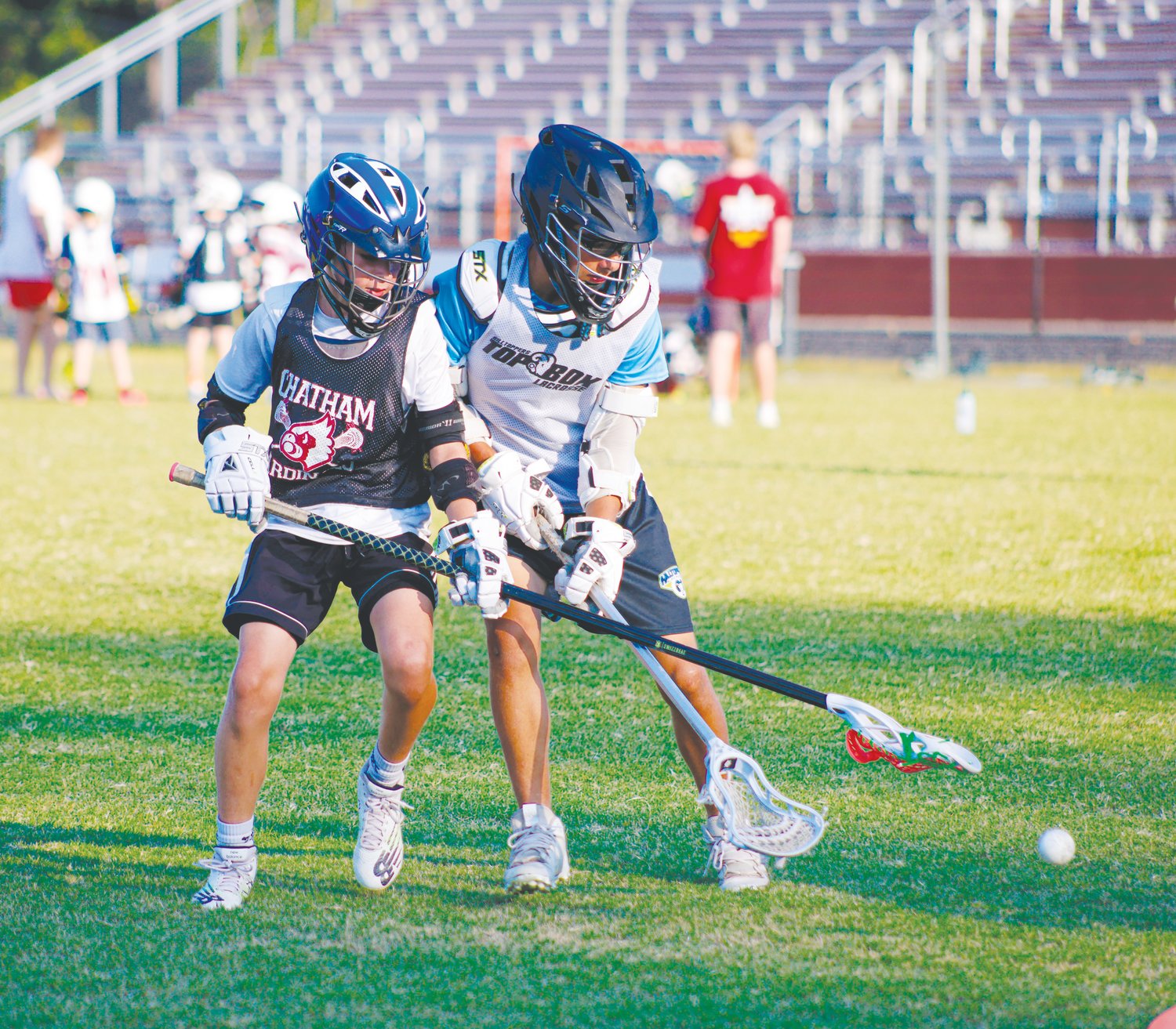 Seaforth camper Oscar Swenson (in black) fights for a loose ball with fellow camper Ivan Grimes during the Hawks' youth lacrosse camp last Thursday.