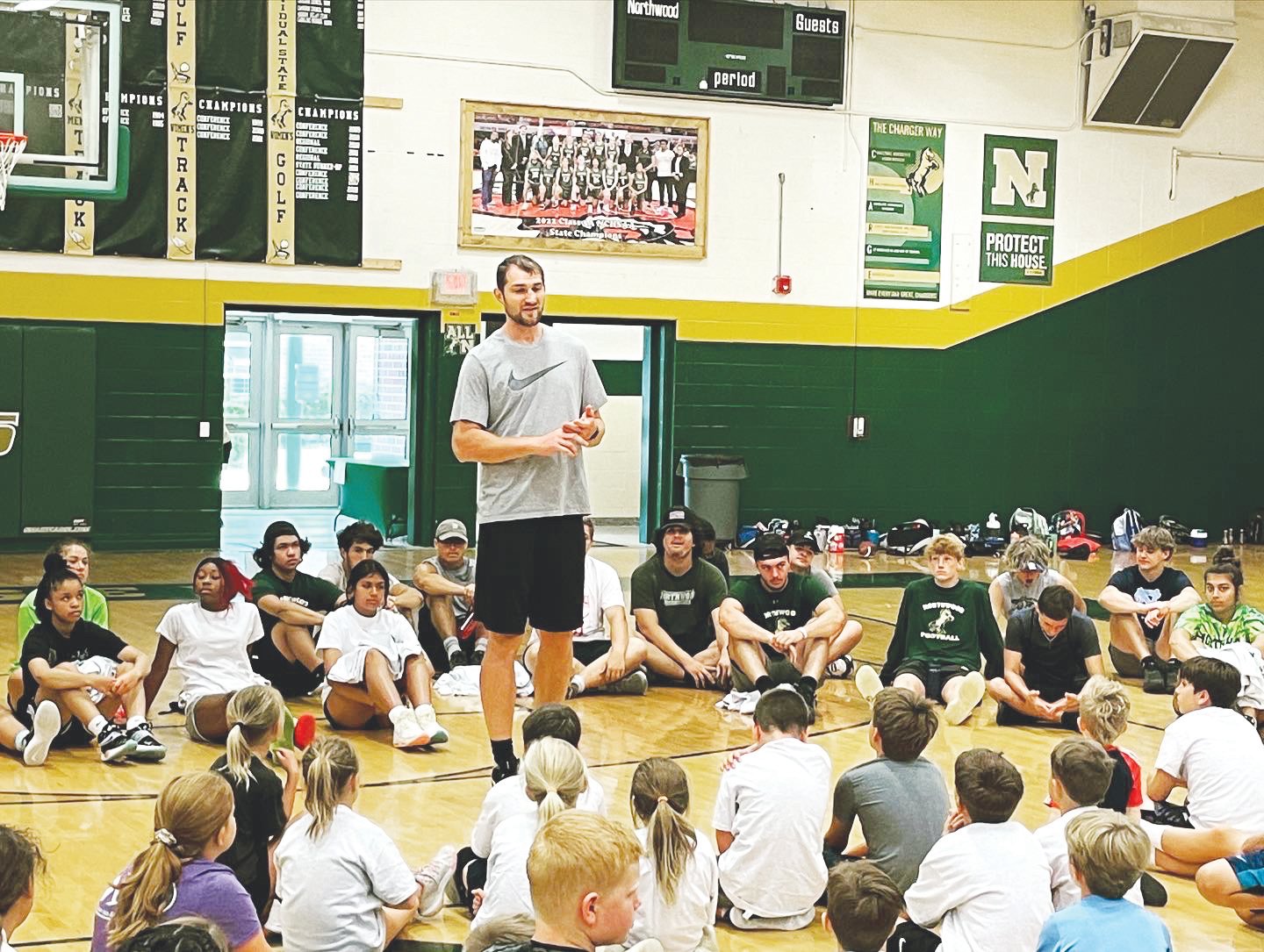 Former UNC Basketball and NBA player Tyler Zeller (center) speaks to a room full of campers at the 4-day Northwood Sports Camp on June 20. Zeller answered questions about his playing career during the session and took photos with each camper in attendance.
