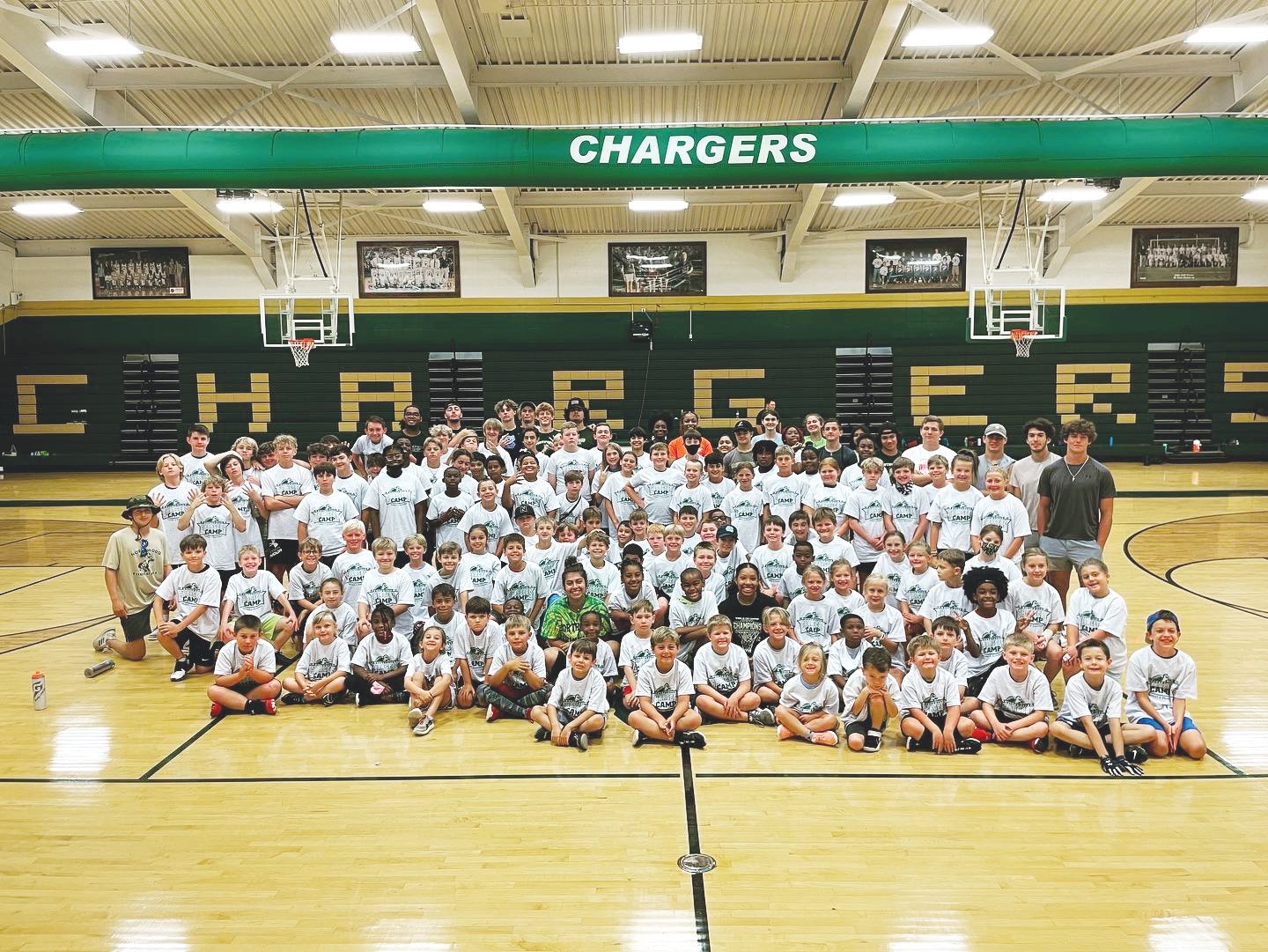 Attendees of the 2022 Northwood Sports Camp take a photo on the first day of camp inside of Northwood's gym on June 20. In total, nearly 120 campers signed up to participate in the 4-day camp centered around basketball and football.