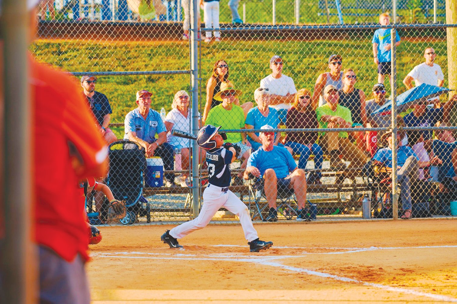 East Chatham's Dylan Lutterloh (center) swings for the fences in his team's 16-7 loss to Davie County in the N.C. Little League District 2 tournament on June 22. East Chatham downed Davie the following night, 23-2, to win the district title.