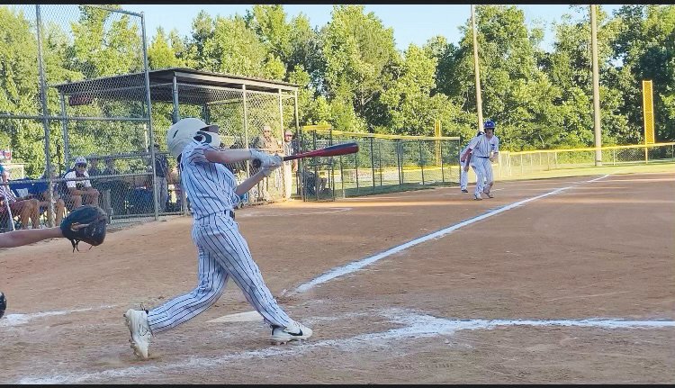 West Chatham 12U All-Stars' slugger Austin Morgan swings at a pitch during the first round of the N.C. Dixie Youth Division 1 O-Zone Tournament on June 18.