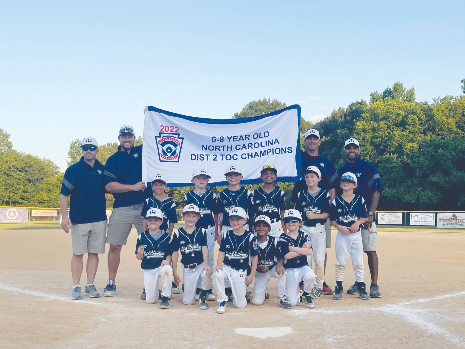 The East Chatham 8U All-Stars pose with the banner after winning the N.C. Little League District 2 title in Pittsboro. East Chatham will head to Wilson in early July for the state tournament, along with its 9U All-Stars team.