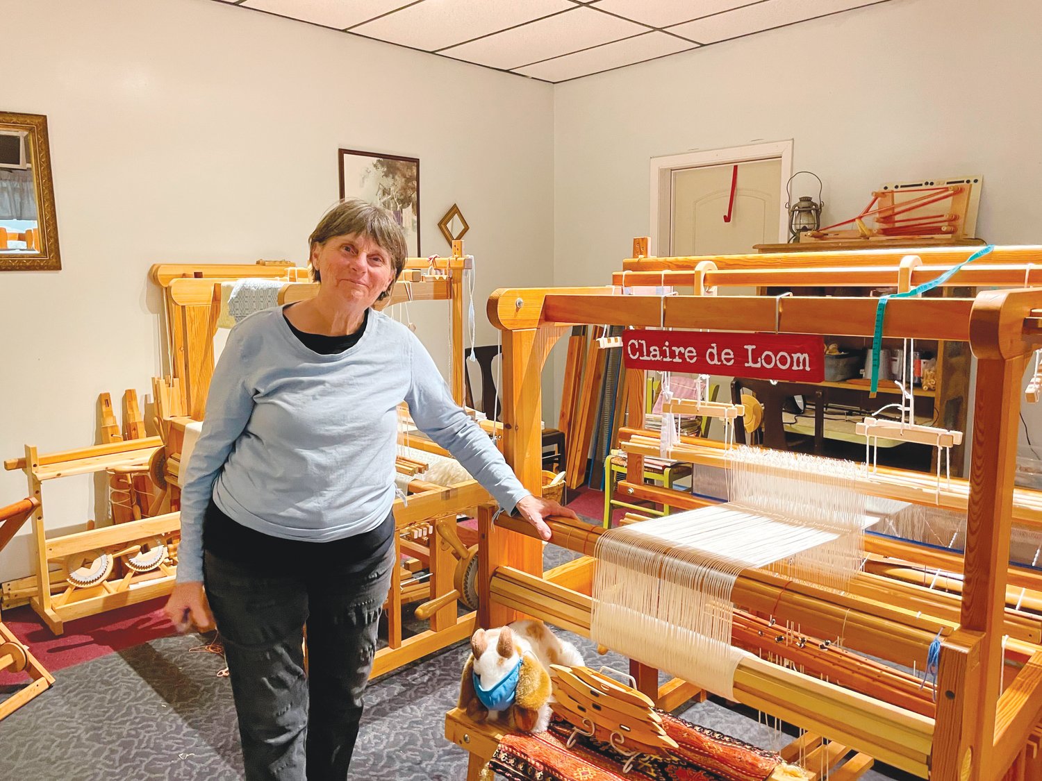 Twin Birch & Teasel co-owner Sue Szary stands next to a loom on Monday at her shop in Siler City. Szary runs the store alongside her husband, Rich.