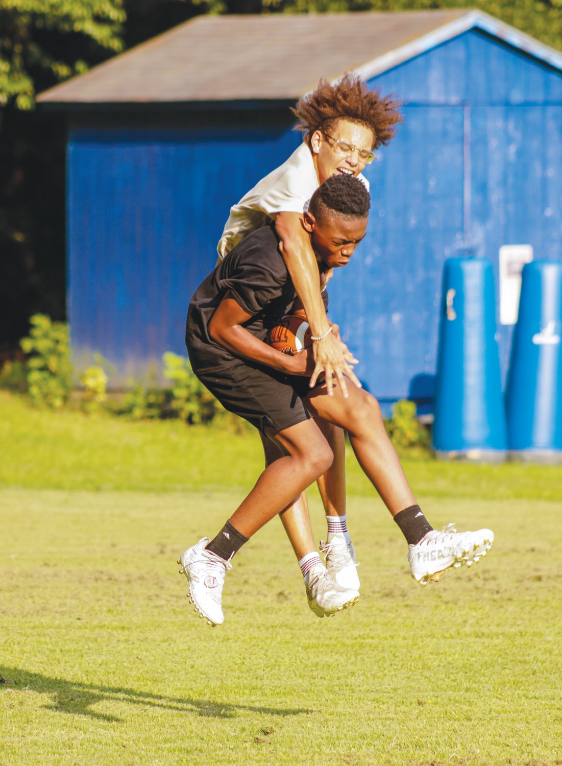 Two Jordan-Matthews football players fight for a jump ball at practice last week. The Jets open the regular season Friday, Aug. 19 at Southwestern Randolph.