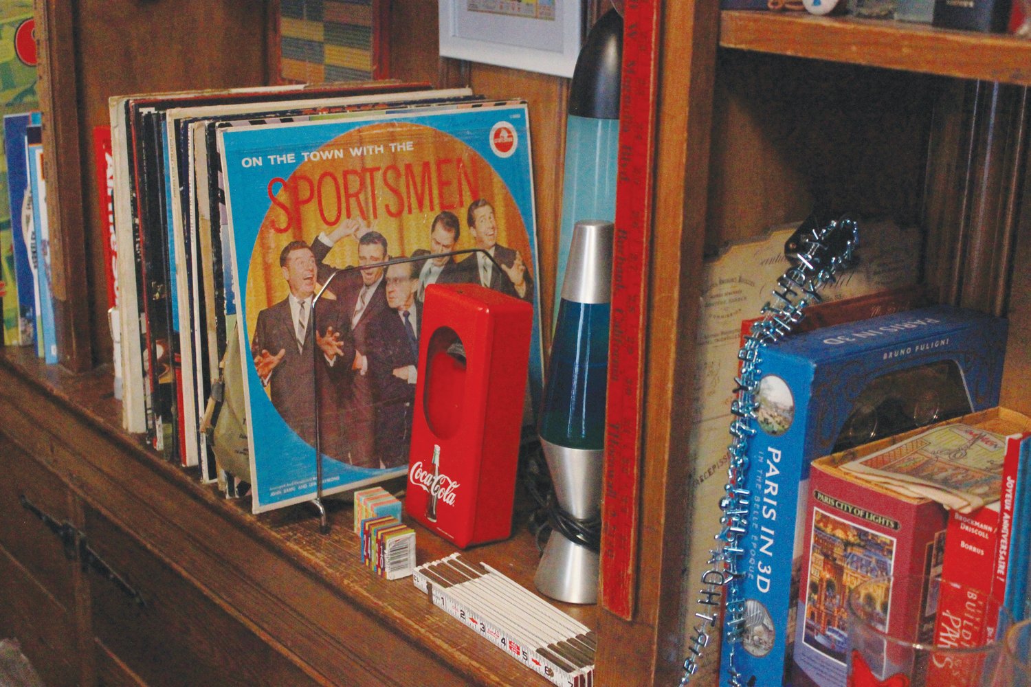 Old vinyl records and ephemera fill the bookcases of the property known as 'Aunt Bee’s house' in Siler City. New owner Kathy Nail is an avid collector of antique toys.