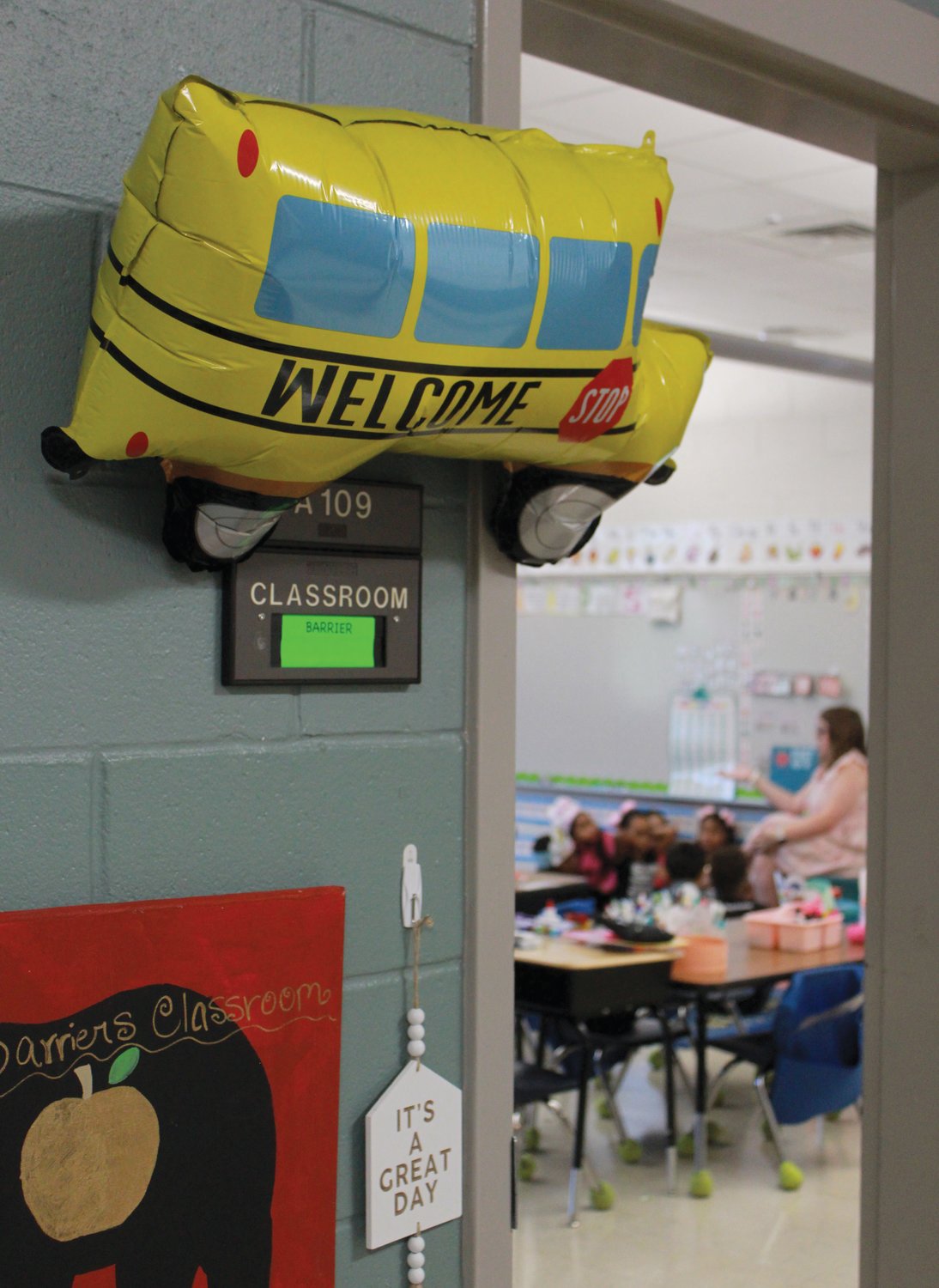 A balloon hangs outside the door of Mrs. Barrier’s 1st grade classroom welcoming students to the first day of school at Virginia Cross Elementary.