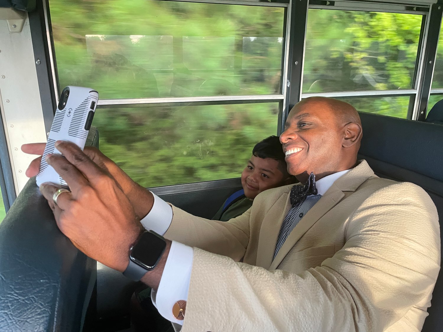 On his way to Virginia Cross Elementary School, Superintendent Dr. Anthony Jackson takes a selfie on the bus with kindergartener Seth Burnette.