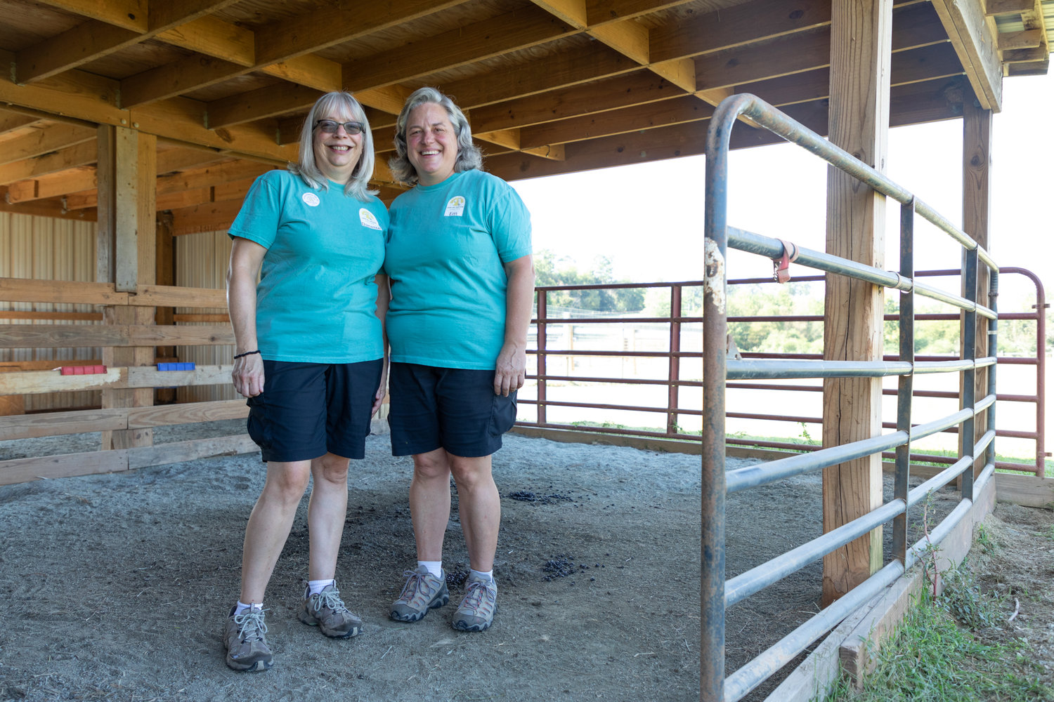 Danette Boezio, left, and Em Stecker, right, owners of Carolina Sunshine Alpaca Farm, pose for a portrait on Saturday.