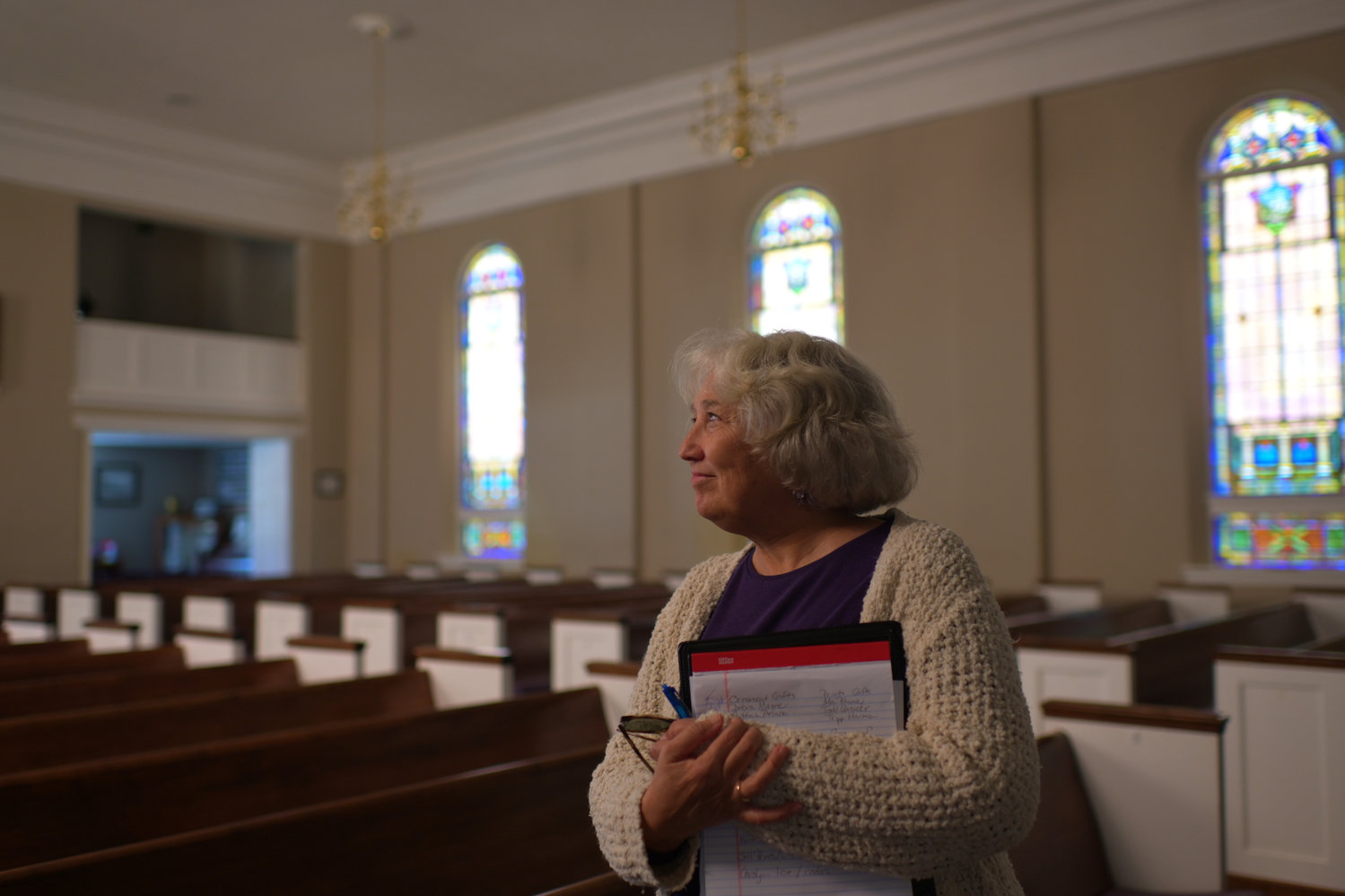Kathy Shaffer, who's helping to coordinate the 175th anniversary activities at Pittsboro Baptist Church, looks around the church's sanctuary. The milestone is being celebrated through October.