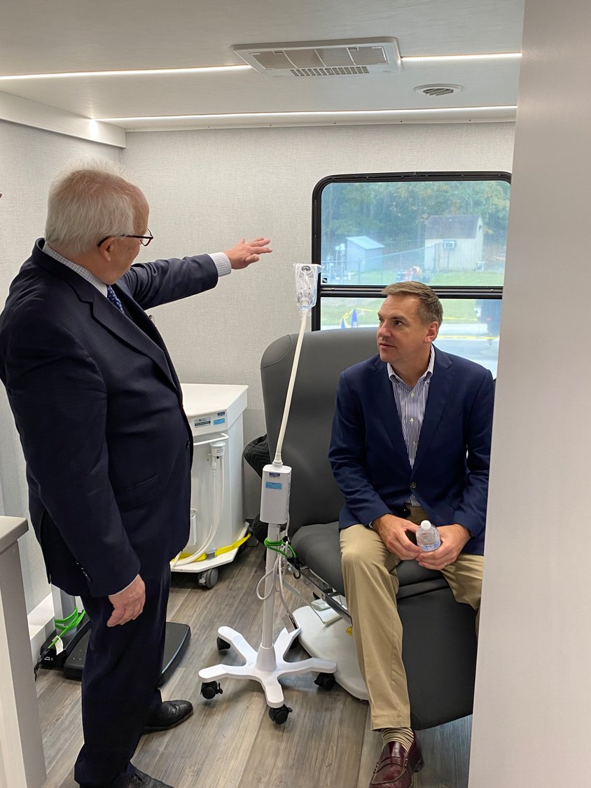 Richard Hudson [right] received a tour of the Moncure Community Health Center last Thursday. He, along with two Democrats, co-sponosred a bill allowing community clinics to use federal funds towards mobile outreach programs.