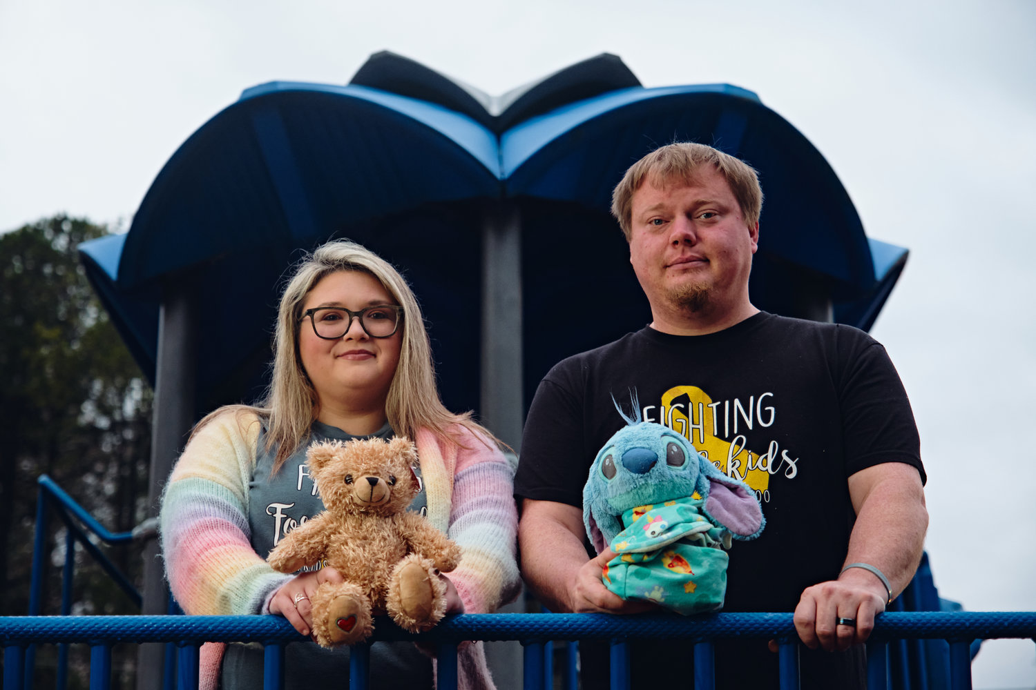 Meghan and Dusty Scoggins hold beloved stuffed animals of their daughter Kenzie, 5, who died from an aggressive brain tumor on Sept. 18. Kenzie loved Disney movies, and her favorite character was Stitch from 'Lilo & Stitch.'