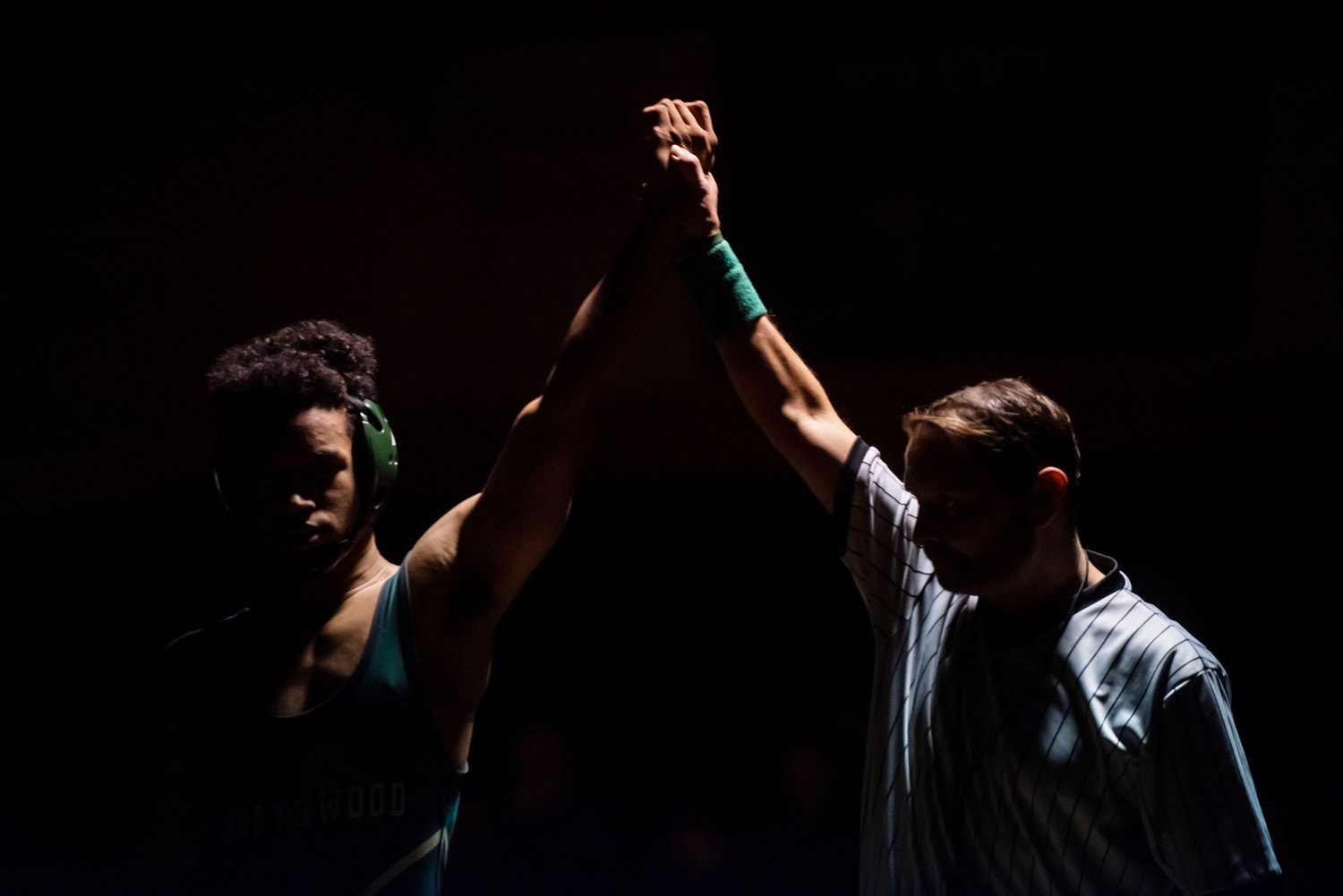 A referee raises Northwood wrestler Elijah Farrow’s arm to signal his victory after his match Friday evening.