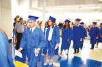 Jordan-Matthews students file past friends and family as they walk towards the gym for their graduation ceremony Saturday morning.