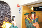 Nina Moll takes a photo of fellow Northwood High graduates Julianna Hubbard and Samantha Ennis Saturday at the Carmichael Arena in Chapel Hill..Moll has plans to study Biochemistry at UNC, Hubbard wants to study English at Guilford, and Ennis is setting her sights on Nursing studies at Campbell.